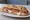 Panuozzo con Prosciutto e Mozzarella: an illustration of prosciutto and mozzarella on ciabatta.