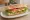 Paris Baguette — Chicken Breast Sandwich: an illustration of chicken, lettuce and tomato on ciabatta.
