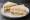 Paris Baguette — Club Sandwich: an illustration of ham, egg, cheese, lettuce and more on white bread.