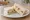 Paris Baguette — Potato Salad Sandwich: an illustration of potato, mayonnaise, apple and raisins on white bread.