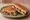 Pastırmalı Tost: an illustration of pastırma and cheese on bread.