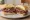 Pastrami Sandwich (כריך פסטרמה): an illustration of pastrami and mustard on white bread.
