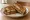 Patty Melt: an illustration of beef, swiss cheese, onion and butter on rye bread.