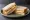 Peanut Butter and Banana: an illustration of peanut butter, banana and butter on white bread.
