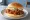 Pelicana Chicken Sandwich: an illustration of chicken on burger bun.