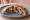 Peloponnese Style: an illustration of pork on pita.