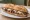 Pepito con Queso: an illustration of beef and cheese on baguette.