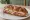 Philadelphia Soft Pretzel Sandwich: an illustration of ham and cheese on pretzel roll.