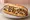 Philly Cheesesteak: an illustration of beef, cheese sauce and onion on hoagie roll.