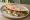 Piadina con Crescenza: an illustration of prosciutto and arugula.