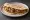 Piadina con Salsiccia e Cipolla: an illustration of sausage, pork and onion.