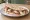 Piadineria Style (Gourmet): an illustration of prosciutto, mozzarella and burrata.