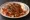 Pideli Köfte: an illustration of beef, tomato, yogurt, butter and more on pita.