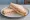 Piece: an illustration of butter on white bread.