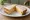 Piece and Cheese: an illustration of cheddar cheese and butter on white bread.