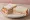 Piece and Ham: an illustration of ham, butter and mustard on white bread.