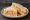 Pimento Cheese Sandwich: an illustration of cheddar cheese and mayonnaise on white bread.