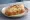 Pintxo de Bacalao: an illustration of cod, olive oil and garlic on baguette.