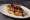 Pintxo de Foie: an illustration of duck on baguette.