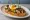 Pintxo de Hongos: an illustration of mushroom, egg, garlic, olive oil and more on baguette.
