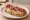 Pintxo de Jamón: an illustration of jamón and olive oil on baguette.