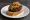 Pintxo de Morcilla: an illustration of morcilla, pork, onion and rice on baguette.