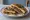 Pissaladière Sandwich: an illustration of anchovy, onion and olives.