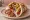 Pita Gyros Diplo (Διπλό): an illustration of pork, tomato, onion, tzatziki and more on pita.