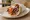 Pita Gyros Horis Patates: an illustration of pork, tomato, onion and tzatziki on pita.