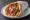 Pita Gyros Horis Tzatziki: an illustration of pork, tomato, onion and potato on pita.