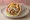 Pita Gyros me Lachanika: an illustration of pork, tomato, onion, lettuce and more on pita.