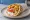 Pita Horis Kreas (Χωρίς Κρέας): an illustration of tomato, onion, tzatziki and potato on pita.