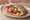 Pita with Cheese and Tomato: an illustration of cheese and tomato on pita.