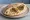 Pita with Labneh (פיתה עם לבנה): an illustration of yogurt and olive oil on pita.