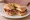 Pitta Calabrese: an illustration of pork, tomato, pepper, anchovy and more on pita.