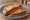 Pizza Canchera: an illustration of mozzarella and tomato.