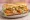 Po' Boy (Catfish): an illustration of lettuce, tomato, pickle and mayonnaise on baguette.
