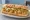 Po' Boy (Shrimp): an illustration of shrimp, lettuce, tomato, pickle and more on baguette.