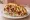 Pomm-Döner: an illustration of chicken, beef, potato, lettuce and more.