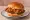 Popeyes Spicy Chicken Sandwich: an illustration of chicken, pickle, mayonnaise and cayenne on burger bun.