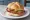 Pork Roll on Kaiser: an illustration of pork and mustard on kaiser roll.