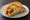Puffy Taco: an illustration of beef, lettuce, tomato and cheese on tortilla.