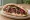 Pulled Lamb Sandwich: an illustration of lamb on pita.