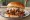 Pulled Pork Sandwich: an illustration of pork, bbq sauce and coleslaw on burger bun.