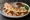 Quesadilla Gringa: an illustration of pork, queso oaxaca, onion, cilantro and more on tortilla.