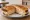Rachel: an illustration of turkey, swiss cheese, coleslaw, russian dressing and more on rye bread.