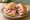 Radieschen Brötchen: an illustration of radish and butter on kaiser roll.
