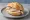 Räucheraal Brötchen: an illustration of horseradish and butter on kaiser roll.