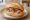 Räucherlachs Brötchen: an illustration of salmon, cream cheese, caper, dill and more on kaiser roll.