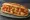 Riggies Sub: an illustration of chicken, tomato, pepper, olive oil and more on hoagie roll.
